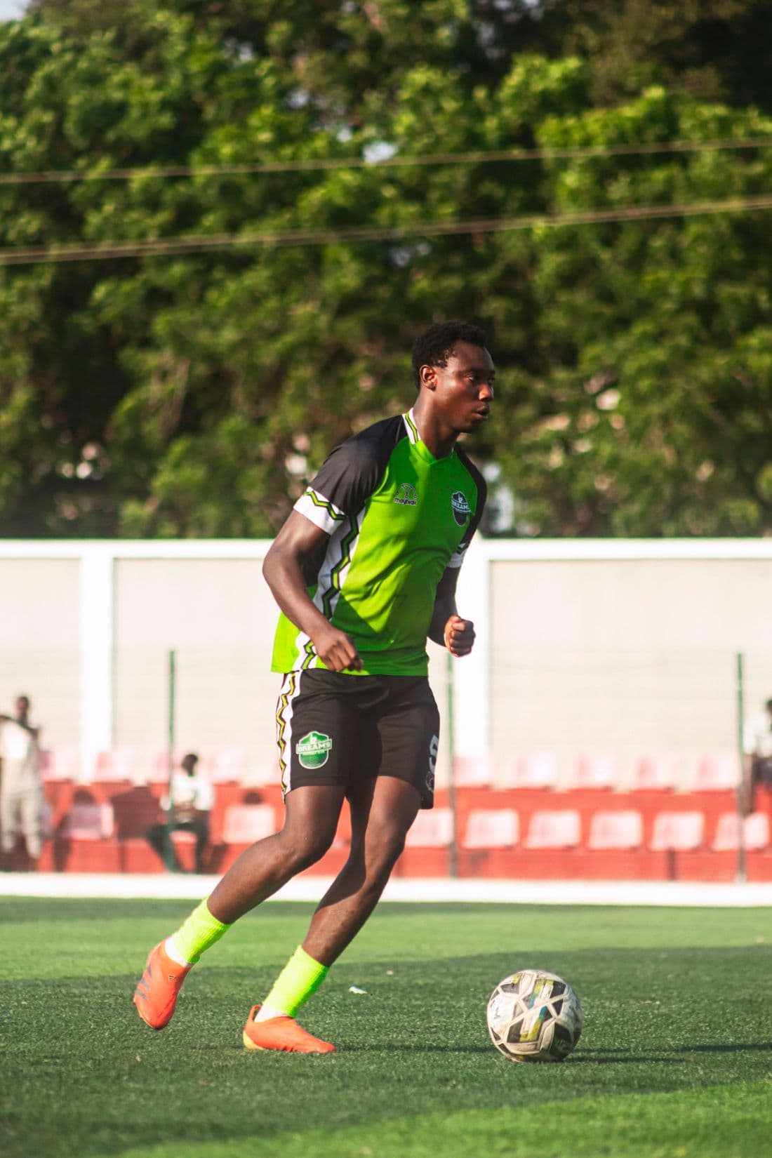 Footballer dribbling the ball during a match
